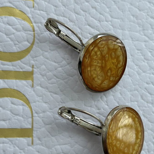 Handmade dangling earrings with warm gold-orange interior, like new