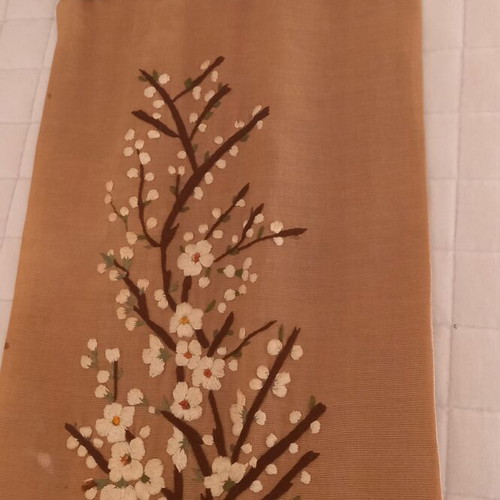 Vintage handmade embroidery with embossed almond blossom design