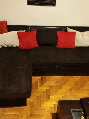 Corner sofa bed, brown with leather texture and storage