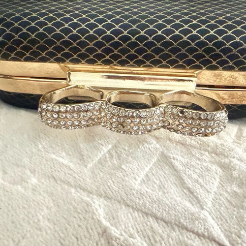 Evening bag like new with unique clasp and black-gold rhinestones