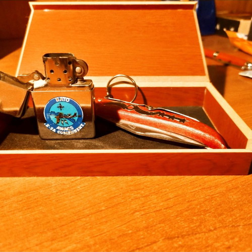 Collectible Zippo lighter 32 years old and handmade Okapi knife.