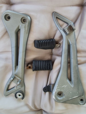 Modenas Kriss genuine footrest bracket with footpegs