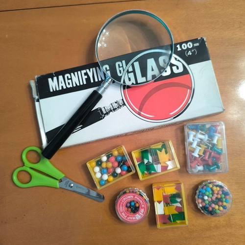 Magnifying glass, scissors and boxes of pins new