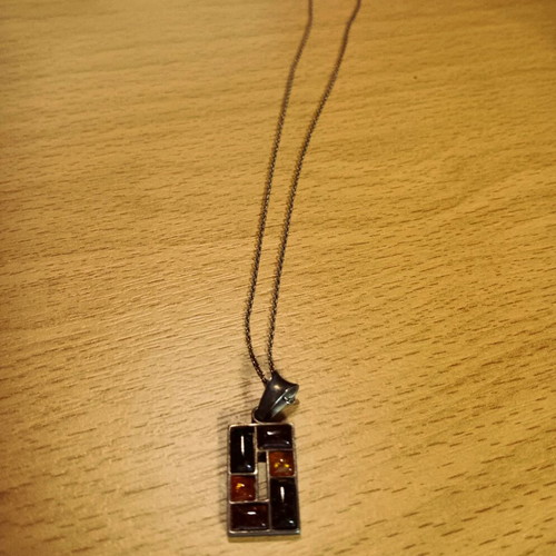 Silver pendant with Baltic amber like new