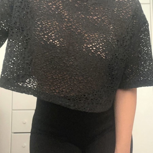 Black perforated blouse like new, medium size, loose fit