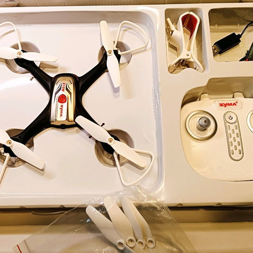 Syma X15W drone used with remote control and video mount
