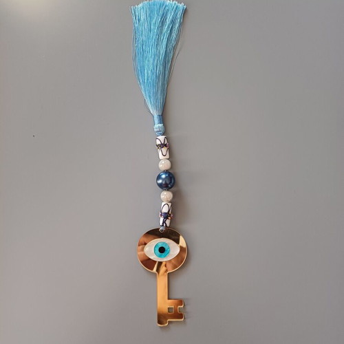 Key charm new with eye made of plexiglass and blue tassel