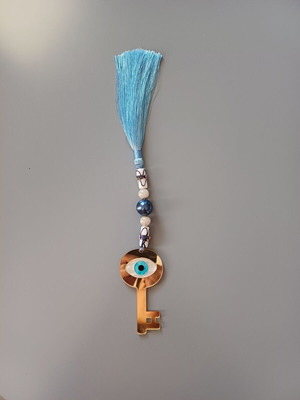Key charm new with eye made of plexiglass and blue tassel