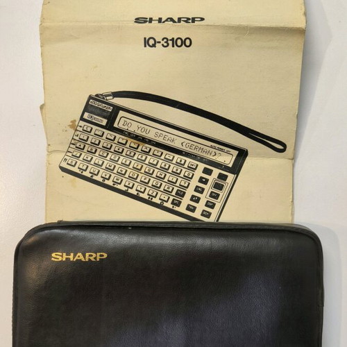 Sharp IQ-3100 electronic translator used with 2 modules and case