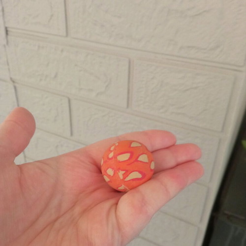 Small orange ball used with design
