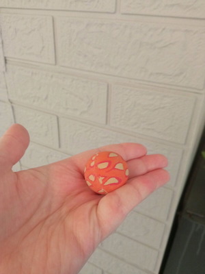 Small orange ball used with design