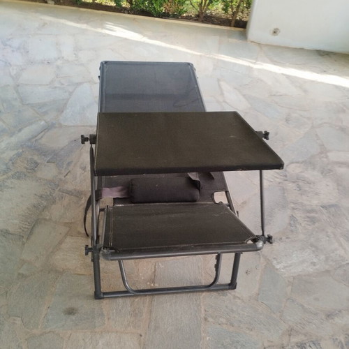 Black sunbed with moveable umbrella and comfort pillow like new