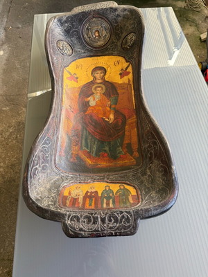 Handmade wooden trough with Orthodox icon used