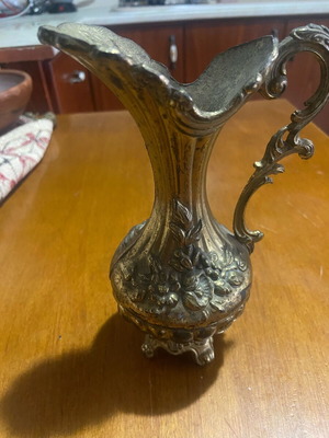Metal vintage decorative vessel like new with embossed floral motifs