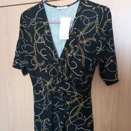 Black dress new with gold drape and pointed hem