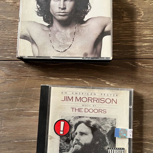 The Doors CDs used, one double and one single