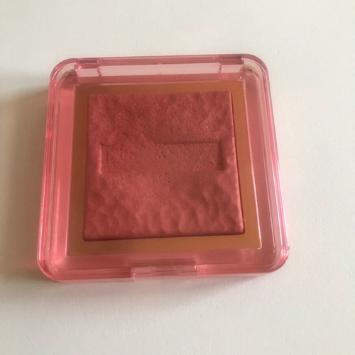 Nabla skin glazing blush lightly used, bright peach pink highlighter