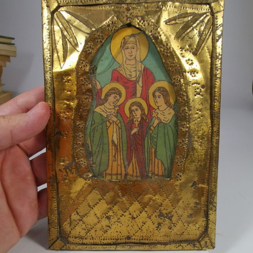 Old metal icon of Saint Sophia with the three daughters used