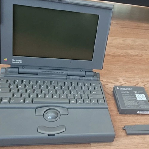 Apple PowerBook 180 laptop used with charger and floppy drive