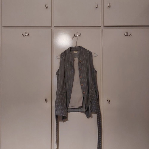 Namaste vest with beige pants like new