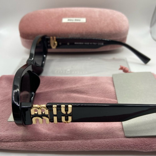 Miu Miu sunglasses new, black and gold for women