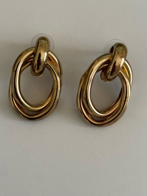 Stainless steel earrings in gold color with knot like new