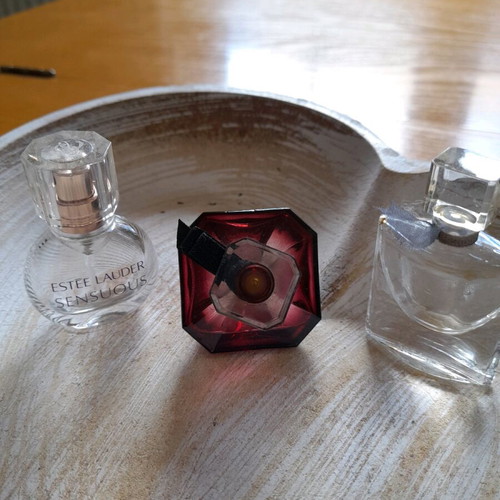 Miniatures of branded perfumes used, empty bottles