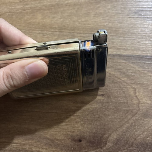 Sunflower lighter used with signs of wear, made in Shanghai