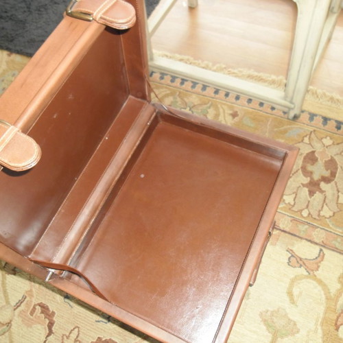 Leather folding table used with suitcase-shaped storage space
