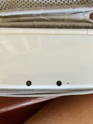 Nintendo 3DS white console with charger and case
