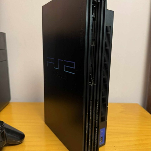 PlayStation 2 console used, does not read CD/DVD, missing covers
