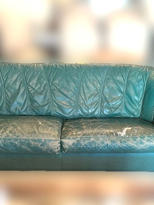 Natuzzi leather three-seater sofa used with repairable seat wear