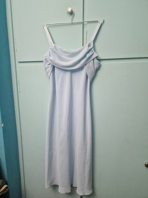 Sleeveless baby blue dress with cowl neck and asymmetric ruffle