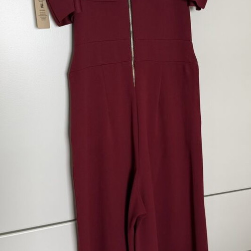 Burgundy jumpsuit with ruffles by Moda new, one size