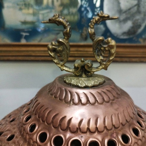 Carved ornate magkali lamp used, folk art