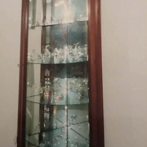 Corner showcase made of solid mahogany like new with lighting