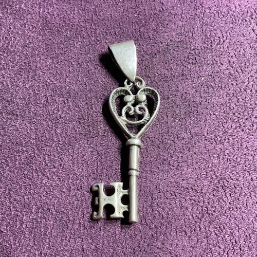 Silver pendant in key shape made of 800 silver