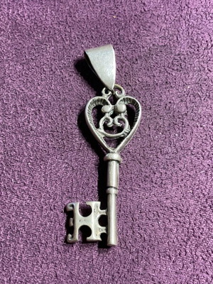 Silver pendant in key shape made of 800 silver