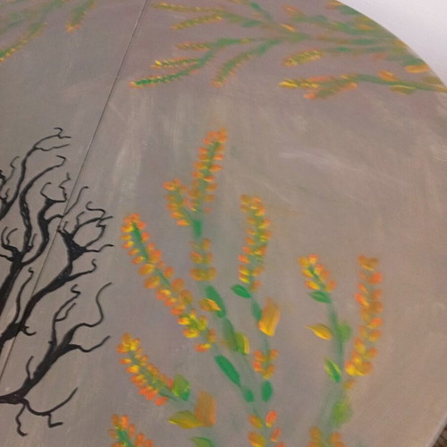 Round table with painted design, chalk paint