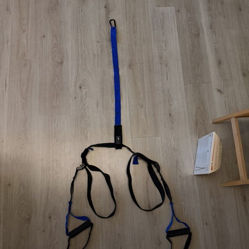 TRX strap used, blue color without ceiling hook