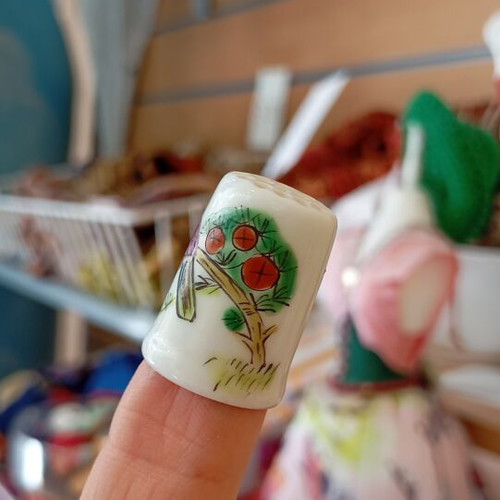 Porcelain thimble like new with bird design
