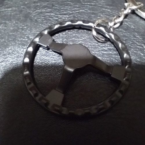 Metal car keychain new with sporting black red steering wheel design