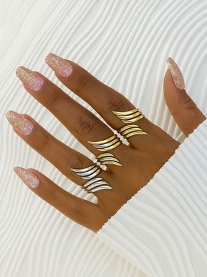Steel ring new, gold tone with claw-like design