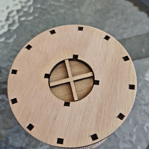 Handmade wooden laser-cut piggy bank with mechanical design