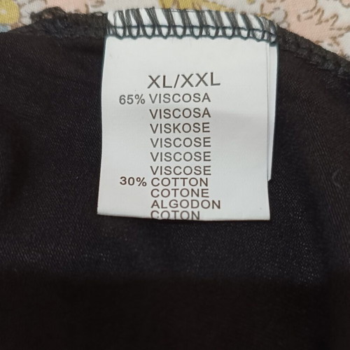 Black oversized t-shirt with gold/beige polka dots and butterflies like new