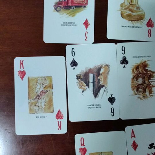 Johnnie Walker collectible playing cards laminated in metal box like new