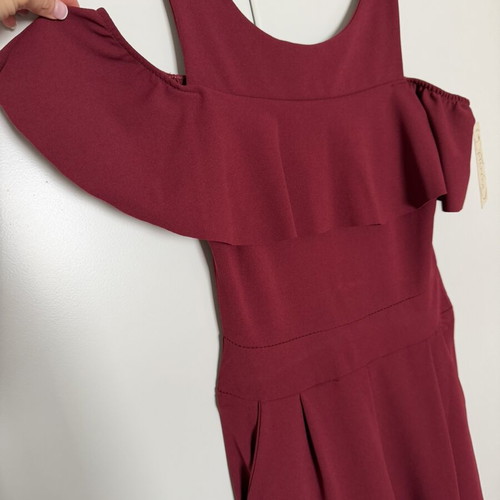 Burgundy jumpsuit with ruffles by Moda new, one size