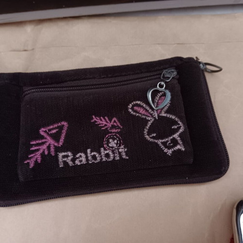 Wallets used, small, multicolored, with non-working zippers