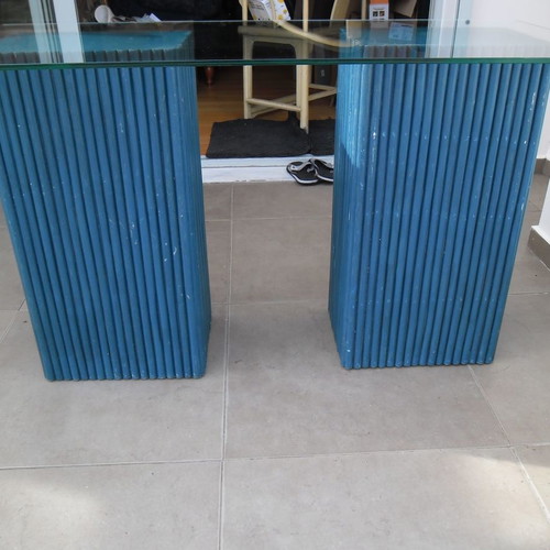 Console table used with 2 blue/navy bases and glass top