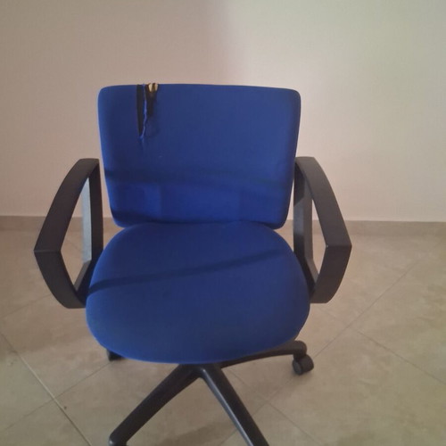 Office chair with fabric defect